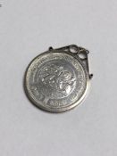 A Bank of Sierra Leone 10th Anniversary one Leone coin in pendant mount.