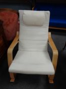 A contemporary beech framed rocking chair