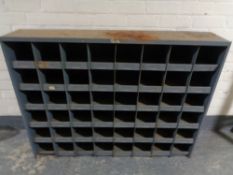 A mid 20th century metal 48-space industrial shelving unit (dimensions 130 cm x 95cm x 25cm deep)