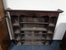 A George III oak plate rack, height 107 cm, wdith 116 cm, depth 19.5 cm.