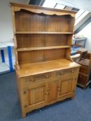 An oak linen fold Welsh dresser