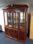 A contemporary display cabinet with cupboards beneath