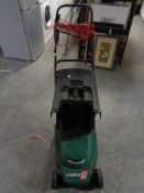 A Qualcast Cobra Quiet 32 electric lawn mower with grass box and lead