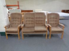 An Ercol late twentieth century beech framed three piece lounge suite in brown dralon