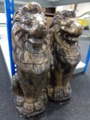 A pair of gilded concrete lion figures