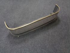 An antique cast iron and brass fire fender on ball feet