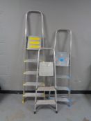 Three sets of aluminium steps