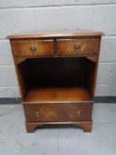 A Chapman's Siesta Regency style cabinet on bracket feet