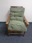 An early 20th century beech framed adjustable armchair