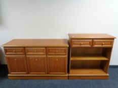 A contemporary teak sideboard with matching bookshelves