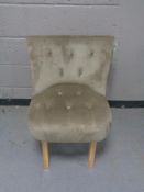 A contemporary button back bedroom chair