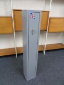 A metal gun cabinet with keys