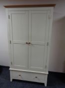 A contemporary painted pine double door wardrobe