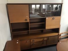 A twentieth century teak cocktail display wall unit