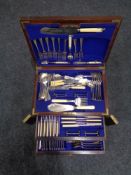 A late 19th century inlaid mahogany cutlery chest containing plated cutlery and servers