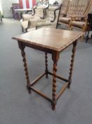 An Edwardian oak pie crust table