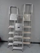 Three sets of aluminium steps