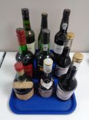 A tray containing nine bottles of alcohol to include port, sherry,