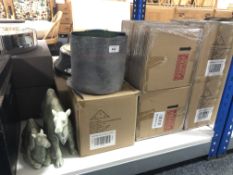 Five boxed circular ceramic candle holders together with two further glazed camel ornaments