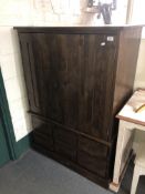 A hardwood double door cabinet fitted with six drawers
