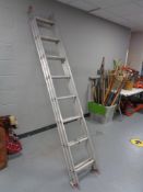 A twin section aluminium 8 rung extension ladder