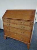 A George III mahogany bureau, height 106 cm, width 92 cm, depth 45 cm.