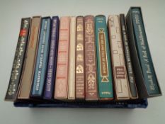 A crate containing 12 Folio Society volumes to include Dylan Thomas, Steinbeck, Thomas Beckett etc,