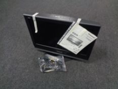 A Panasonic Viera 26 inch LCD TV with remote together with a further box containing assorted