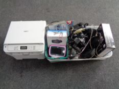 A Brother multifunction printer together with a crate containing VR headset, compact DVD player,