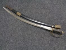 An Indian brass handled sword in scabbard