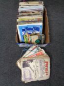 A box containing vinyl LPs,