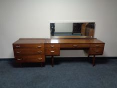 A three piece twentieth century Stag teak bedroom suite, comprising of double door wardrobe,