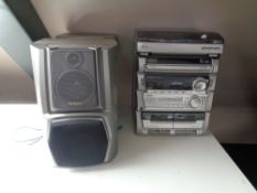 An Aiwa Hi-Fi system with speakers and remotes