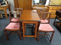 A 1930s oak barley twist drop leaf table,