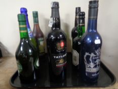 A tray containing nine assorted bottles of alcohol to include sherry, babysham, port etc.