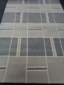 A contemporary woolen rug, 305 x 205 cm.