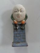 A cast iron Humpty Dumpty money box