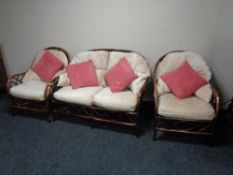 A three piece bamboo and wicker conservatory suite
