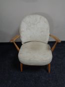 An Ercol solid elm and beech armchair