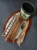 An oval mahogany framed mirror together with a driftwood sculpture,