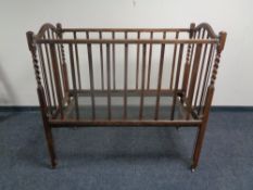 An Edwardian oak barley twist cot