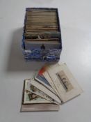 A box containing antiquarian and later postcards to include silk examples