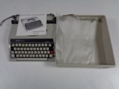 A cased Boots PT800 portable typewriter with original instructions.
