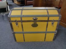 A 20th century metal bound painted dome topped trunk.