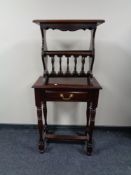 An Indonesian mahogany hall table fitted with drawer together with similar magazine rack.