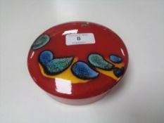 A Poole Pottery lidded powder bowl, diameter 14cm.