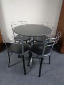 A marble topped bistro table on four way pedestal together with a set of four leather and metal