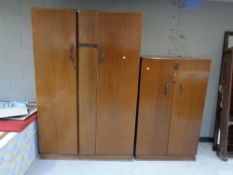 A 1930's oak Distinctive Furniture lady's and gent's wardrobe