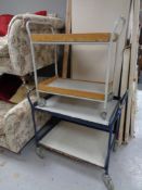 Two 20th century tubular metal two-tier trolleys