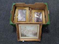 A box containing four framed oils to include landscape scenes.